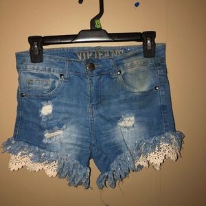Blue jean stressed and ripped shorts